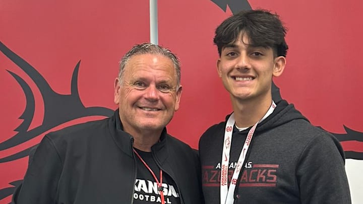 Arkansas Razorbacks coach Sam Pittman with Lakeland, Fla., recruit Joaquin Kavouklis during an April recruiting trip to Fayetteville, Ark.