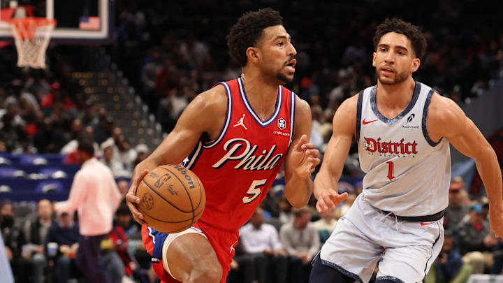 Apr 9, 2025; Washington, District of Columbia, USA; Philadelphia 76ers guard Quentin Grimes (5) drives to the basket as Washington Wizards guard Colby Jones (1) depends in the first half at Capital One Arena. Mandatory Credit: Geoff Burke-Imagn Images