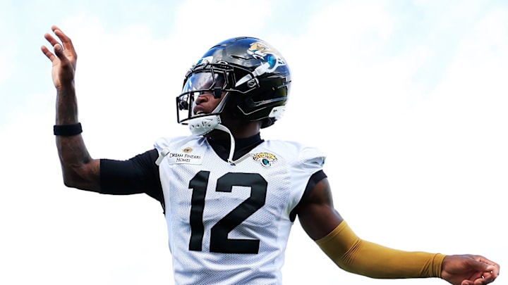 Jacksonville Jaguars wide receivers Brian Thomas Jr. (7), Travis Hunter (12) and Dyami Brown (5) work on reflexes using tennis balls during an NFL training camp session at the Miller Electric Center, Friday, July 25, 2025, in Jacksonville, Fla. [Corey Perrine/Florida Times-Union]