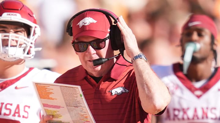 Arkansas interim coach Bobby Petrino studies his offensive play sheet during Saturday's 34-31 loss to No. 22 Tennessee at Neyland Stadium in Knoxville, Tenn. Arkansas interim coach Bobby Petrino studies his offensive play sheet during Saturday's 34-31 loss to No. 22 Tennessee at Neyland Stadium in Knoxville, Tenn.