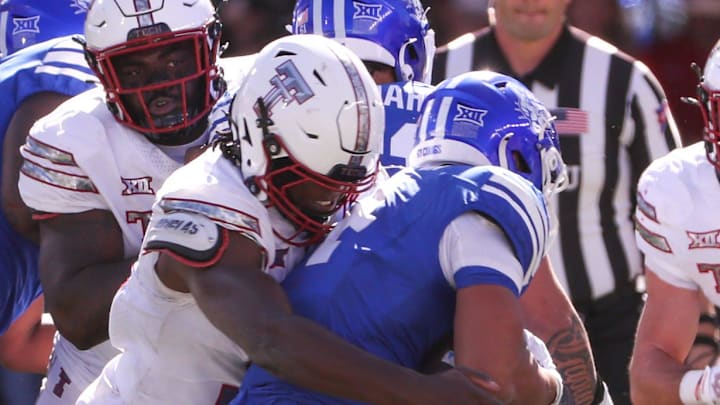 Texas Tech's David Bailey wraps up the BYU ball carrier during a Big 12 Conference football game, Saturday, Nov. 8, at Jones AT&T Stadium.