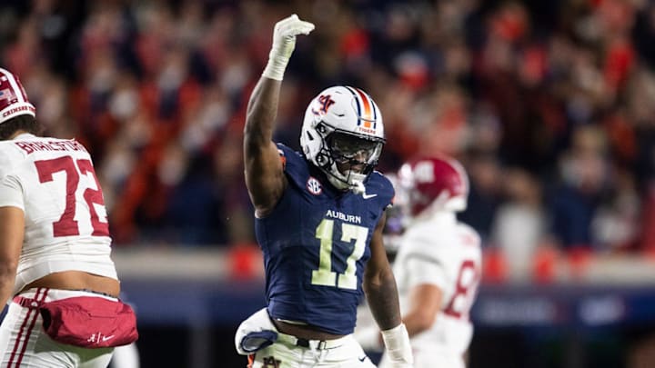 Auburn Tigers linebacker Xavier Atkins (17) celebrates his sack as against the Alabama Crimson Tide in the Iron Bowl at Jordan-Hare Stadium.