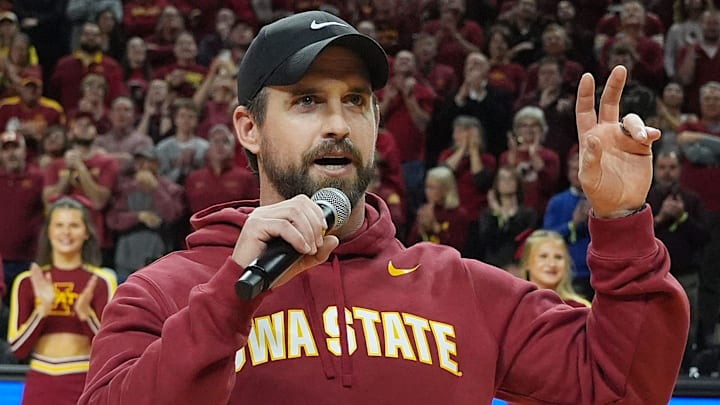 Iowa State football coach Jimmy Rogers speaks during a timeout in the Cy-Hawk men's basketball game on Dec. 11, 2025, at Hilton Coliseum in Ames.