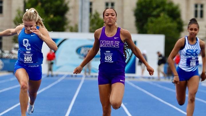 Male High School junior Grace Bethel won the girls' 100 meters Saturday at the Kentucky High School State 3A Track and Field Championships. Bethel defeated formidable opponents, Clara Warrick of Oldham County (left of Bethel) and Alexis Howard of Simon Kenton (right of Bethel), clocking 11.77.