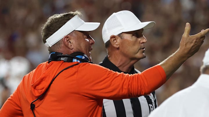 Sep 6, 2025; Auburn, Alabama, USA; Auburn Tigers head coach Hugh Freeze complains to a game official as they look at the Jumbotron during the third quarter against the Ball State Cardinals at Jordan-Hare Stadium. Mandatory Credit: John Reed-Imagn Images Sep 6, 2025; Auburn, Alabama, USA; Auburn Tigers head coach Hugh Freeze complains to a game official as they look at the Jumbotron during the third quarter against the Ball State Cardinals at Jordan-Hare Stadium. Mandatory Credit: John Reed-Imagn Images