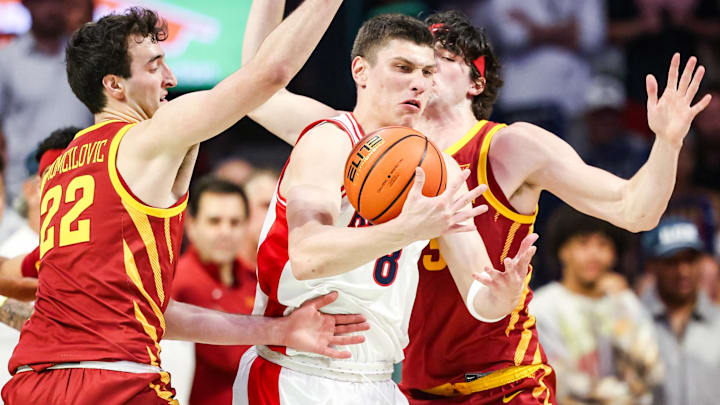 Mar 2, 2026; Tucson, Arizona, USA; Arizona Wildcats forward Ivan Kharchenkov (8) attempts to keep possession of the ball during the first half of the game against the Iowa State Cyclones at McKale Memorial Center.