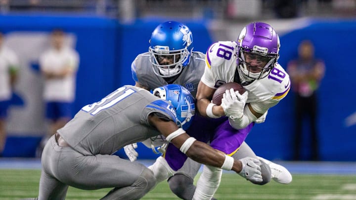 Detroit Lions safety Kerby Joseph (31) tackles Minnesota Vikings wideout Justin Jefferson (18) 