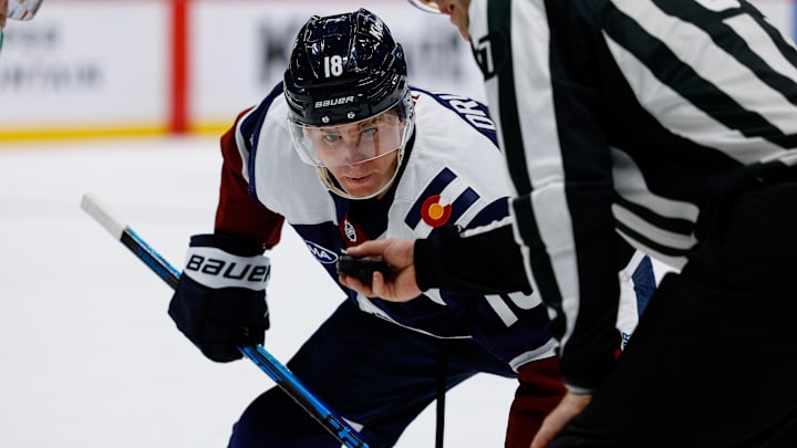 Mar 18, 2026; Denver, Colorado, USA; Colorado Avalanche center Jack Drury (18) watches the puck in the hand of linesman Devin Berg (87) before a face off in the second period against the Dallas Stars at Ball Arena. Mandatory Credit: Isaiah J. Downing-Imagn Images Mar 18, 2026; Denver, Colorado, USA; Colorado Avalanche center Jack Drury (18) watches the puck in the hand of linesman Devin Berg (87) before a face off in the second period against the Dallas Stars at Ball Arena. Mandatory Credit: Isaiah J. Downing-Imagn Images