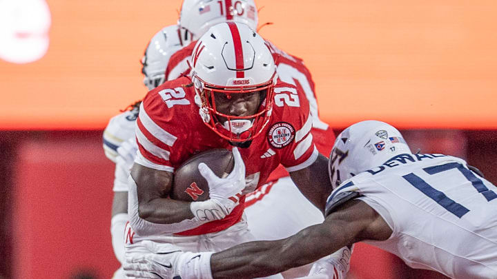 Nebraska running back Emmett Johnson picks up 10 yards on a rush against Akron.