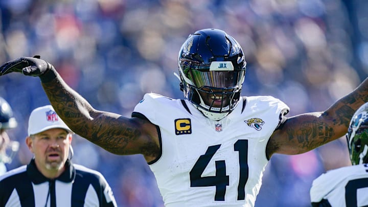 Jacksonville Jaguars defensive end Dawuane Smoot (98) and defensive end Josh Hines-Allen (41) celebrate sacking Tennessee Titans quarterback Cam Ward (1) during the second quarter at Nissan Stadium in Nashville, Tenn., Sunday, Nov. 30, 2025.