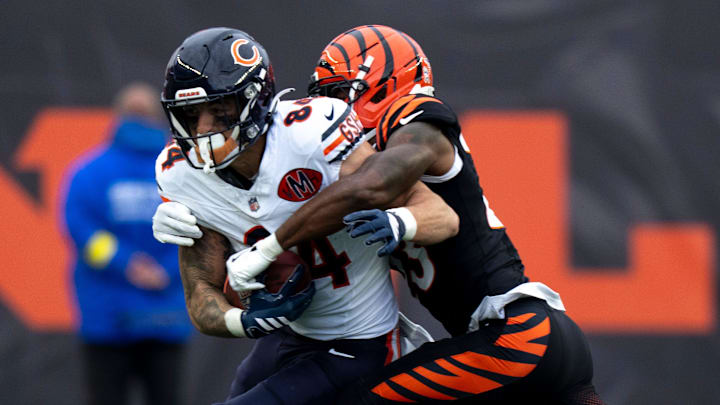 Cincinnati Bengals cornerback Dax Hill (23) tackles Chicago Bears tight end Colston Loveland (84) in the second quarter of the NFL football game between Chicago Bears and Cincinnati Bengals at Paycor Stadium in Cincinnati on Nov. 2, 2025.