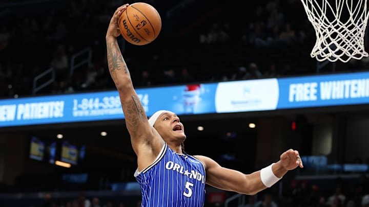 Jan 6, 2026; Washington, District of Columbia, USA; Orlando Magic forward Paolo Banchero (5) dunks the ball over Washington Wizards guard CJ McCollum (3) during the first half at Capital One Arena. Mandatory Credit: Daniel Kucin Jr.-Imagn Images