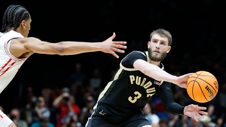Houston Cougars guard Milos Uzan (7) defends the pass of Purdue Boilermakers guard Braden Smith (3) 