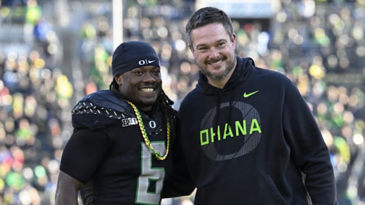 Nov 22, 2025; Eugene, Oregon, USA; Oregon Ducks running back Noah Whittington (6) poses for a photo with head coach Dan Lanning before the game against the Southern California Trojans at Autzen Stadium. Mandatory Credit: Troy Wayrynen-Imagn Images