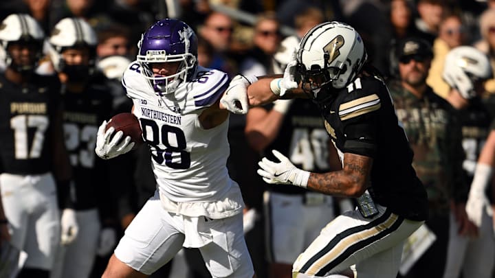 Nov 2, 2024; West Lafayette, Indiana, USA; Northwestern Wildcats tight end Marshall Lang (88) pushes away Purdue Boilermakers defensive back Antonio Stevens (11) during the second quarter at Ross-Ade Stadium. Mandatory Credit: Marc Lebryk-Imagn Images