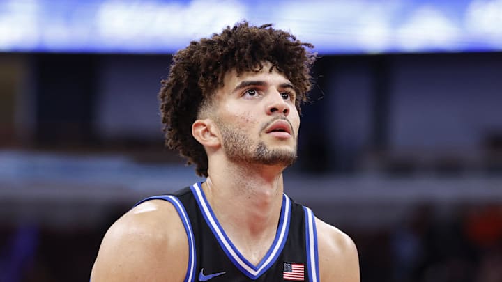 Nov 27, 2025; Chicago, Illinois, USA; Duke Blue Devils forward Cameron Boozer (12) shoots a free throw against the Arkansas Razorbacks during the second half at United Center. Mandatory Credit: Kamil Krzaczynski-Imagn Images Nov 27, 2025; Chicago, Illinois, USA; Duke Blue Devils forward Cameron Boozer (12) shoots a free throw against the Arkansas Razorbacks during the second half at United Center. Mandatory Credit: Kamil Krzaczynski-Imagn Images