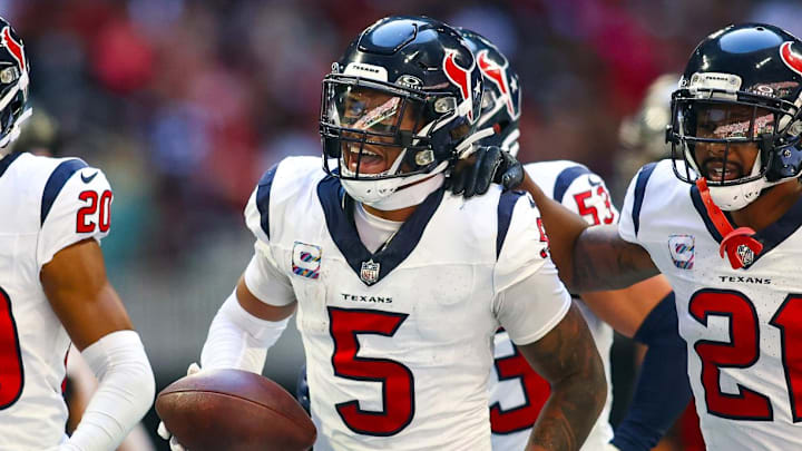 Oct 8, 2023; Atlanta, Georgia, USA; Houston Texans safety Jalen Pitre (5) celebrates with cornerback Ka'dar Hollman (20) and cornerback Steven Nelson (21) after a fumble recovery against the Atlanta Falcons in the second half at Mercedes-Benz Stadium. Mandatory Credit: Brett Davis-Imagn Images