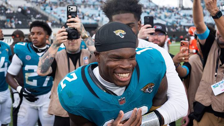 Jacksonville Jaguars wide receiver Travis Hunter (12) and Cleveland Browns quarterback Shedeur Sanders (2) joke around at midfield after an NFL football game at EverBank Stadium, Sunday, September 13, 2026, in Jacksonville, Fla. 