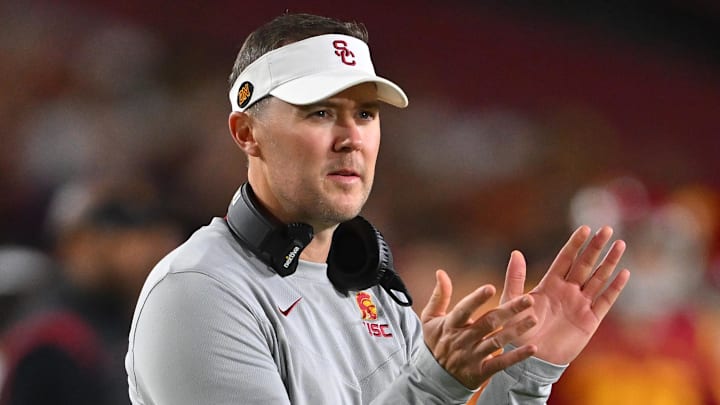 Oct 1, 2022; Los Angeles, California, USA;  USC Trojans head coach Lincoln Riley applauds after a touchdown in the first half against the Arizona State Sun Devils at United Airlines Field at the Los Angeles Memorial Coliseum. Mandatory Credit: Jayne Kamin-Oncea-Imagn Images