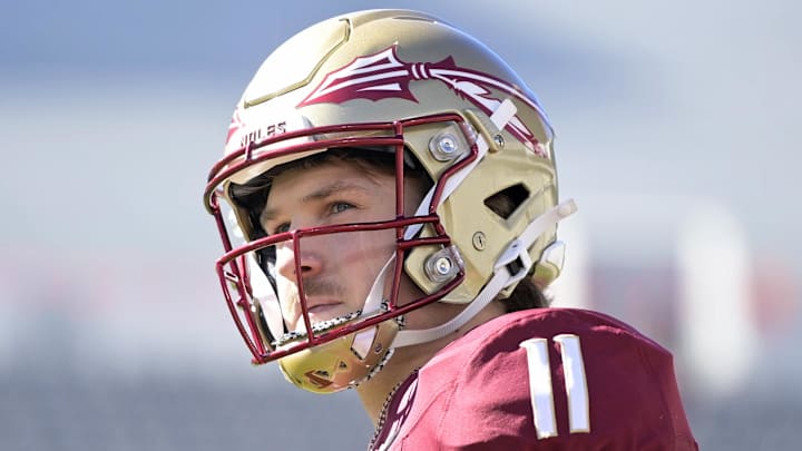 Nov 23, 2024; Tallahassee, Florida, USA; Florida State Seminoles quarterback Brock Glenn (11) warms up before the game against the Charleston Southern Buccaneers at Doak S. Campbell Stadium. Mandatory Credit: Melina Myers-Imagn Images
