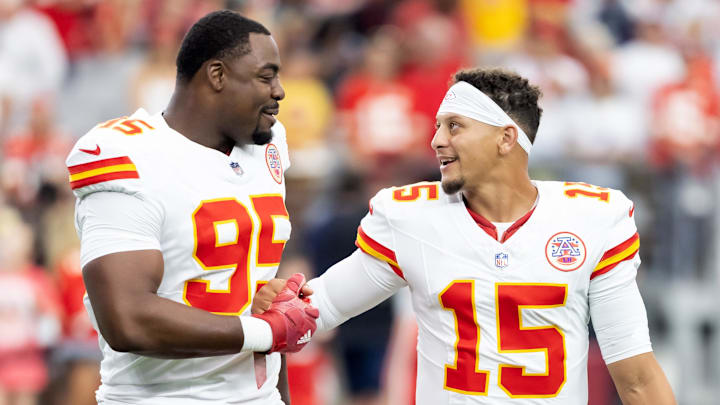 Aug 9, 2025; Glendale, Arizona, USA; Kansas City Chiefs defensive tackle Chris Jones (95) with quarterback Patrick Mahomes (15) against the Arizona Cardinals during a preseason NFL game at State Farm Stadium. Mandatory Credit: Mark J. Rebilas-Imagn Images
