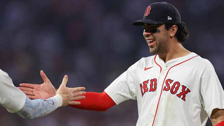 Boston Red Sox third baseman Marcelo Mayer (39) celebrates with Boston Red Sox shortstop Trevor Story (10) during the sixth inning against the Tampa Bay Rays at Fenway Park.