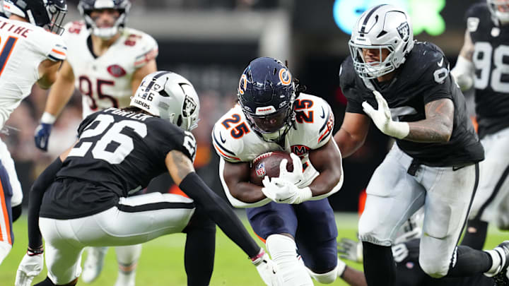 Sep 28, 2025; Paradise, Nevada, USA; Chicago Bears running back Kyle Monangai (25) runs the ball against Las Vegas Raiders cornerback Darien Porter (26) during the second half at Allegiant Stadium. Mandatory Credit: Stephen R. Sylvanie-Imagn Images Sep 28, 2025; Paradise, Nevada, USA; Chicago Bears running back Kyle Monangai (25) runs the ball against Las Vegas Raiders cornerback Darien Porter (26) during the second half at Allegiant Stadium. Mandatory Credit: Stephen R. Sylvanie-Imagn Images