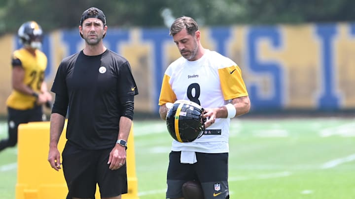 Jun 10, 2025; Pittsburgh, PA, USA;  Pittsburgh Steelers quarterback Aaron Rodgers (8) puts on his helmet during minicamp at their South Side facility. Mandatory Credit: Philip G. Pavely-Imagn Images