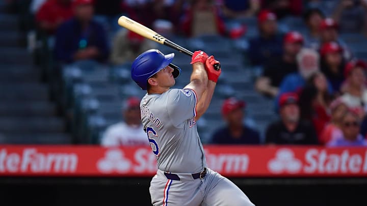 Sep 27, 2024; Anaheim, California, USA; Texas Rangers center fielder Wyatt Langford (36) hits a two run home run against the Los Angeles Angels during the first inning at Angel Stadium.