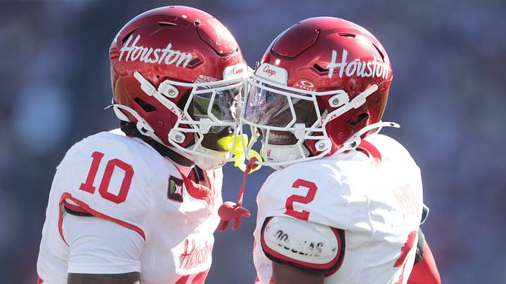 Houston Cougars cornerback Jalen Mayo (2) celebrates a stop against Kansas State Wildcats with Houston Cougars defensive end Latreveon McCutchin (10) during the game inside Bill Snyder Family Stadium in Manhattan, Kansas, on Oct. 10, 2026.