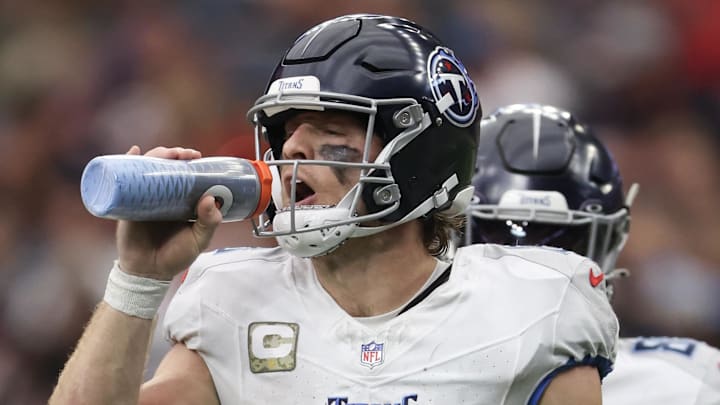Nov 24, 2024; Houston, Texas, USA; Tennessee Titans quarterback Will Levis (8) drinks water between downs against the Houston Texans in the third quarter at NRG Stadium. Mandatory Credit: Thomas Shea-Imagn Images