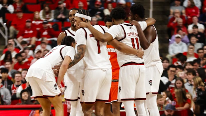 Jan 27, 2026; Raleigh, North Carolina, USA; NC State Wolfpack players huddle during the second half of the game against the Syracuse Orange at Lenovo Center. Mandatory Credit: Jaylynn Nash-Imagn Images