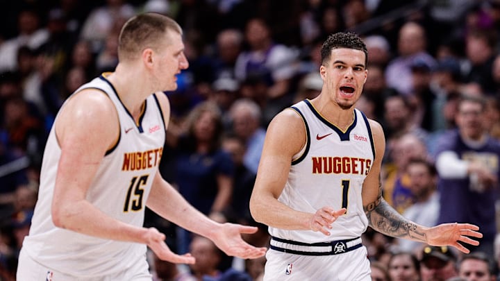 Mar 21, 2024; Denver, Colorado, USA; Denver Nuggets forward Michael Porter Jr. (1) and center Nikola Jokić (15) in the third quarter against the New York Knicks at Ball Arena.