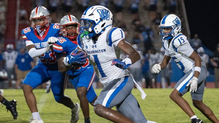 Wildcats Gionni Lewis (1) carries the ball against the Eagles during the Booker T. Washington vs Pine Forest football game at Pine Forest High School in Pensacola on Aug. 21, 2026. Wildcats Gionni Lewis (1) carries the ball against the Eagles during the Booker T. Washington vs Pine Forest football game at Pine Forest High School in Pensacola on Aug. 21, 2026.