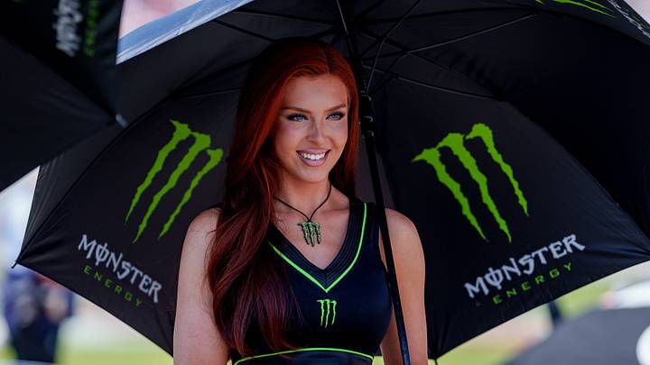 Apr 26, 2025; Talladega, Alabama, USA; A model for Monster Energy poses with fans at Talladega Superspeedway. Mandatory Credit: Jason Allen-Imagn Images