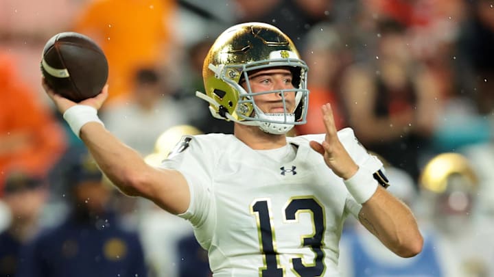 Aug 31, 2025; Miami Gardens, Florida, USA; Notre Dame Fighting Irish quarterback CJ Carr (13) drops back to pass against the Miami Hurricanes during the first quarter at Hard Rock Stadium. Aug 31, 2025; Miami Gardens, Florida, USA; Notre Dame Fighting Irish quarterback CJ Carr (13) drops back to pass against the Miami Hurricanes during the first quarter at Hard Rock Stadium.