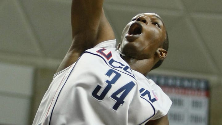 Jan 3, 2008; Storrs, CT, USA; Connecticut Huskies center Hasheem Thabeet (34) drives the ball to the basket past Rutgers Scarlet Knights forward JR Inman (15) in the second half at Gampel Pavilion. UConn defeated Rutgers 80-49. Mandatory Credit: David Butler II-Imagn Images