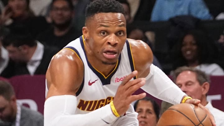 Oct 29, 2024; Brooklyn, New York, USA; Denver Nuggets point guard Russell Westbrook (4) dribbles the ball toward the basket against the Brooklyn Nets during the first half of the game at Barclays Center. Mandatory Credit: Gregory Fisher-Imagn Images