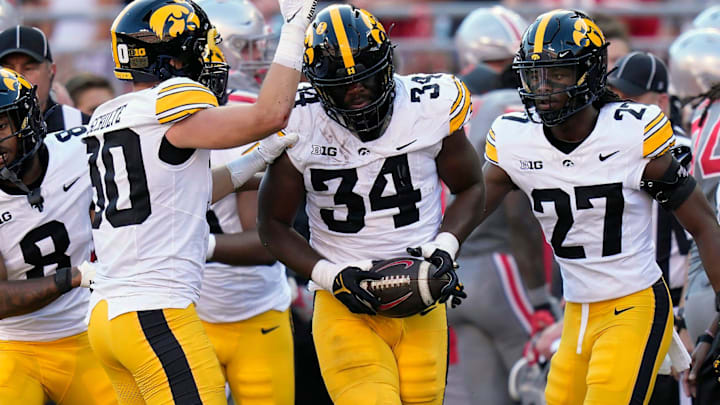 Oct 5, 2024; Columbus, OH, USA; Iowa Hawkeyes linebacker Jay Higgins (34) recovers a fumble against Ohio State Buckeyes in the second quarter during the NCAA football game at Ohio Stadium. Oct 5, 2024; Columbus, OH, USA; Iowa Hawkeyes linebacker Jay Higgins (34) recovers a fumble against Ohio State Buckeyes in the second quarter during the NCAA football game at Ohio Stadium.