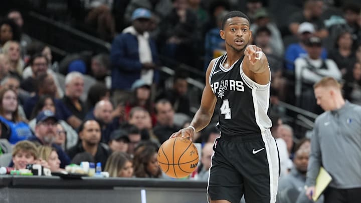 Mar 10, 2025; San Antonio, Texas, USA; San Antonio Spurs guard De'Aaron Fox (4) points in the first half against the Dallas Mavericks at Frost Bank Center.