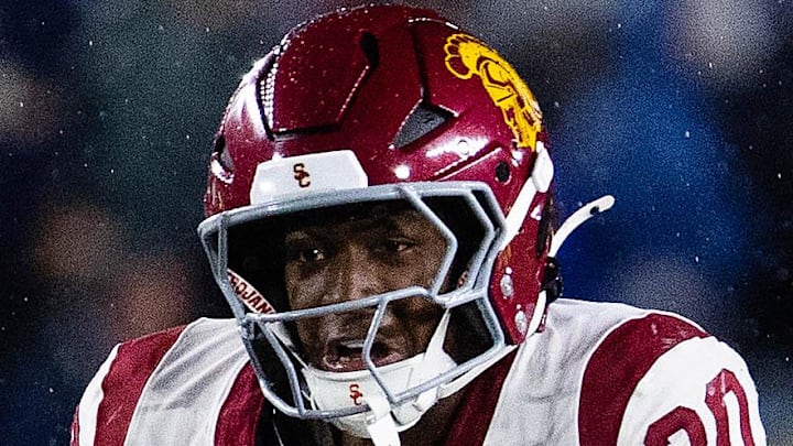 Oct 18, 2025; South Bend, Indiana, USA; Southern California Trojans running back King Miller (30) runs the ball while Notre Dame Fighting Irish safety Tae Johnson (9) defends in the second half at Notre Dame Stadium. Mandatory Credit: Trevor Ruszkowski-Imagn Images