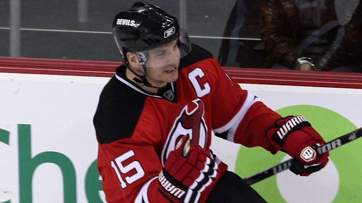 Mar 25, 2010; Newark, NJ, USA; New Jersey Devils right wing Jamie Langenbrunner (15) celebrates after scoring during the third period against the New York Rangers at the Prudential Center. The Rangers won 4-3 in a shootout.  Mandatory Credit: Ed Mulholland-Imagn Images