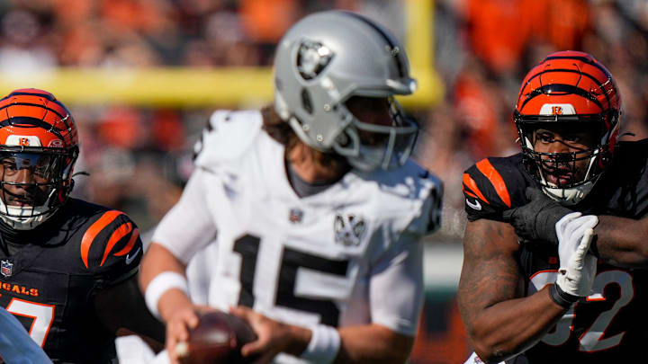 Cincinnati Bengals linebacker Germaine Pratt (57) and defensive tackle B.J. Hill (92) pursue Las Vegas Raiders quarterback Gardner Minshew (15) in the first quarter of the NFL Week 9 game between the Cincinnati Bengals and the Las Vegas Raiders at Paycor Stadium in downtown Cincinnati on Sunday, Nov. 3, 2024. Cincinnati Bengals linebacker Germaine Pratt (57) and defensive tackle B.J. Hill (92) pursue Las Vegas Raiders quarterback Gardner Minshew (15) in the first quarter of the NFL Week 9 game between the Cincinnati Bengals and the Las Vegas Raiders at Paycor Stadium in downtown Cincinnati on Sunday, Nov. 3, 2024.