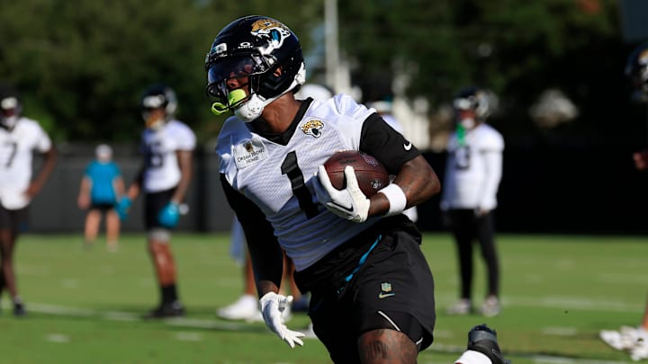 Jacksonville Jaguars running back Travis Etienne Jr. (1) runs the ball during an NFL training camp session at the Miller Electric Center, Monday, Aug. 11, 2025 in Jacksonville, Fla. [Corey Perrine/Florida Times-Union]
