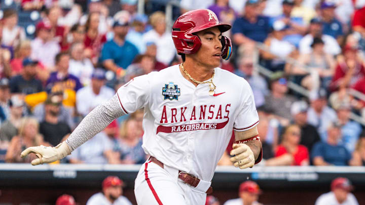 Jun 14, 2025; Omaha, Neb, USA; Arkansas Razorbacks shortstop Wehiwa Aloy (9) runs after hitting a single against the LSU Tigers during the fourth inning at Charles Schwab Field. Mandatory Credit: Dylan Widger-Imagn Images Jun 14, 2025; Omaha, Neb, USA; Arkansas Razorbacks shortstop Wehiwa Aloy (9) runs after hitting a single against the LSU Tigers during the fourth inning at Charles Schwab Field. Mandatory Credit: Dylan Widger-Imagn Images