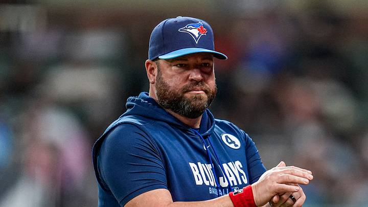 Toronto Blue Jays manager John Schneider on the field against the Atlanta Braves during the eighth inning at Truist Park. Mandatory Credit: Dale Zanine-Imagn Images