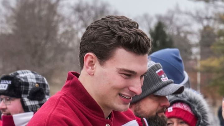 Jan 24, 2026; Bloomington, IN, USA; Indiana Hoosiers quarterback Fernando Mendoza touches the rock Saturday, Jan. 24, 2026, during a championship celebration for the Indiana Hoosiers at Memorial Stadium. Mandatory Credit: Grace Smith-USA TODAY Network via Imagn Images