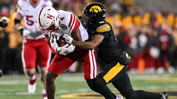 Nov 29, 2024; Iowa City, Iowa, USA; Nebraska Cornhuskers wide receiver Jahmal Banks (4) gets yards after the catch as Iowa Hawkeyes defensive back Deshaun Lee (8) makes the tackle during the second quarter at Kinnick Stadium. Mandatory Credit: Jeffrey Becker-Imagn Images Nov 29, 2024; Iowa City, Iowa, USA; Nebraska Cornhuskers wide receiver Jahmal Banks (4) gets yards after the catch as Iowa Hawkeyes defensive back Deshaun Lee (8) makes the tackle during the second quarter at Kinnick Stadium. Mandatory Credit: Jeffrey Becker-Imagn Images