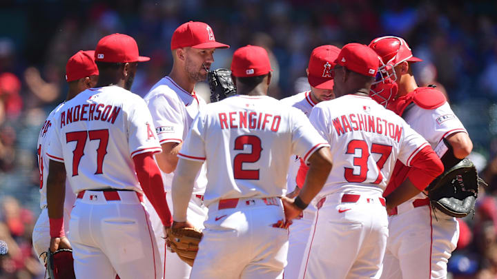 Angels manager Ron Washington (37) meets with pitcher Tyler Anderson (31) and the infield during the fifth inning at Angel Stadium on April 6.