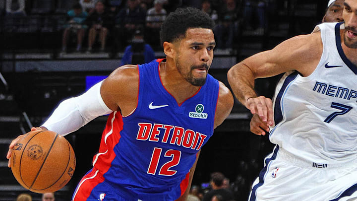 Oct 6, 2025; Memphis, Tennessee, USA; Detroit Pistons forward Tobias Harris (12) drives to the basket as Memphis Grizzlies forward Santi Aldama defends during the first quarter at FedExForum. Mandatory Credit: Petre Thomas-Imagn Images